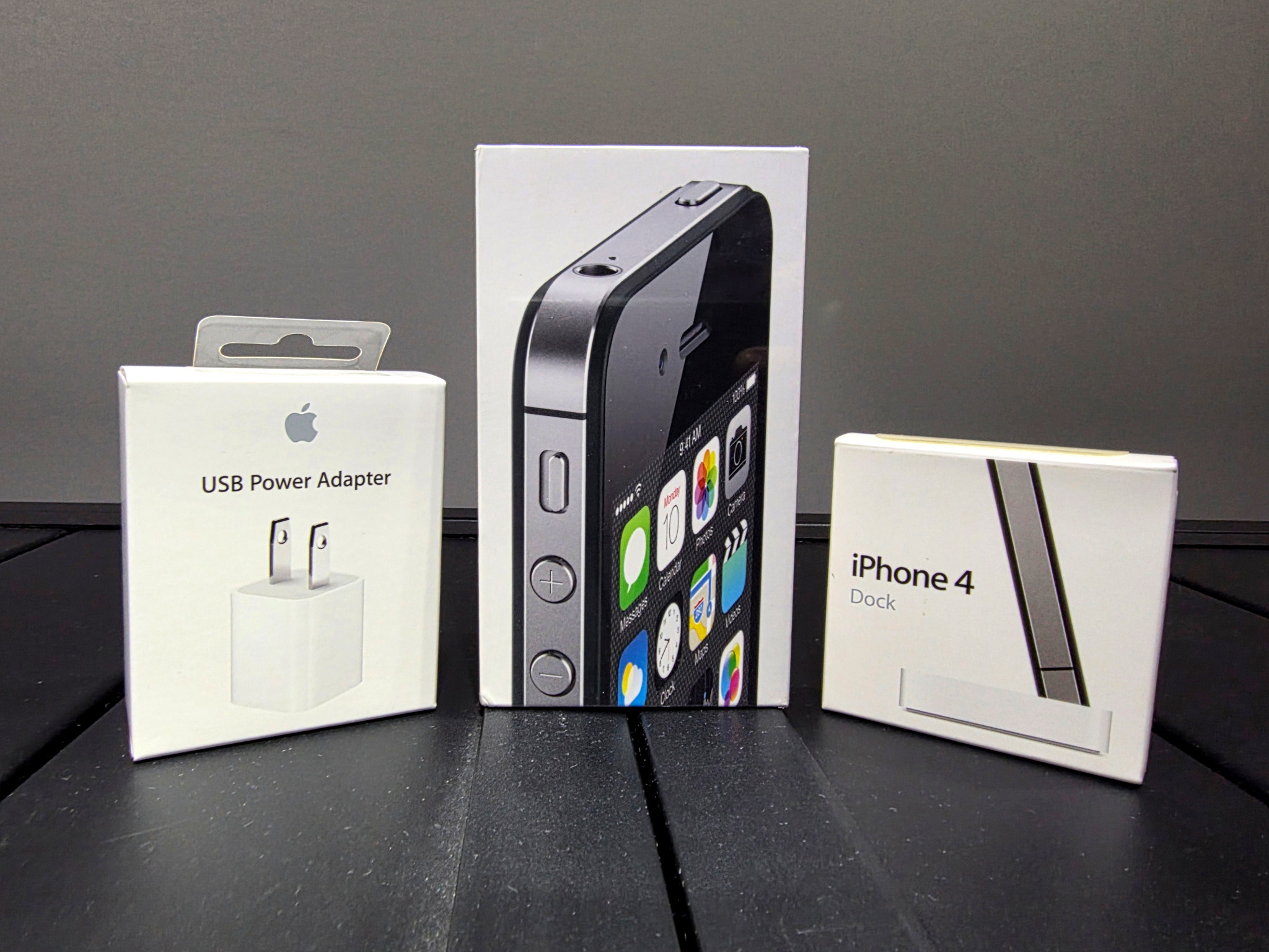 Apple accessories bundle including USB power adapter and iPhone 4 dock